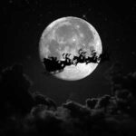 Silhouette of Santa’s sleigh flying past a full moon surrounded by dark clouds