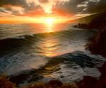 Golden sunset over the ocean with dramatic clouds, soft waves, and rugged cliffs along the shoreline