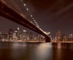 Night view of Brooklyn Bridge with New York City's skyline in the background, captured in an LED Box Frame to enhance your home or office decor.