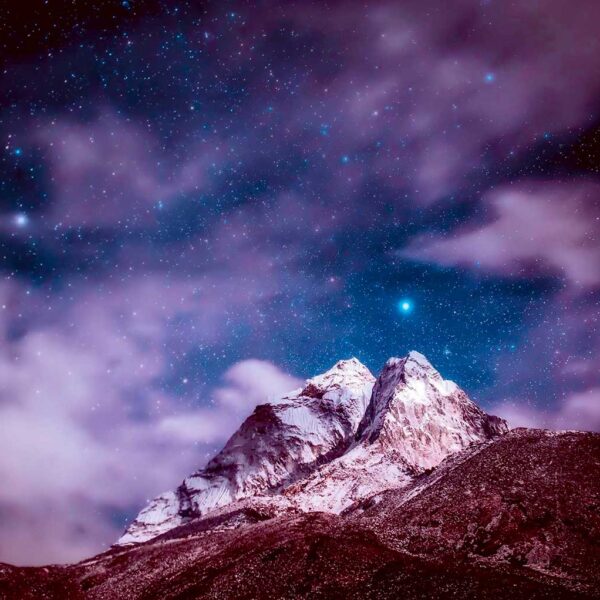 A stunning view of the Himalayas under a cosmic sky, illuminated by the twinkling stars, perfect for displaying in an LED Box Frame.