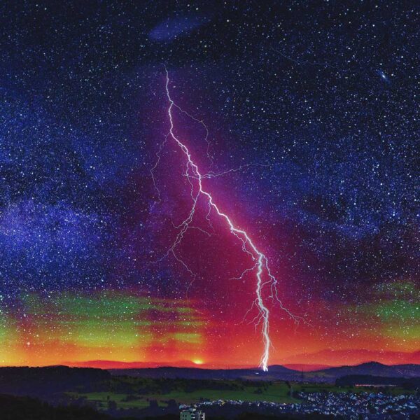 Striking lightning bolt cutting through the night sky, with vibrant aurora and stars, captured in an LED Box Frame.