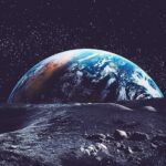 View of Earth from the Moon with a starry sky and lunar surface.