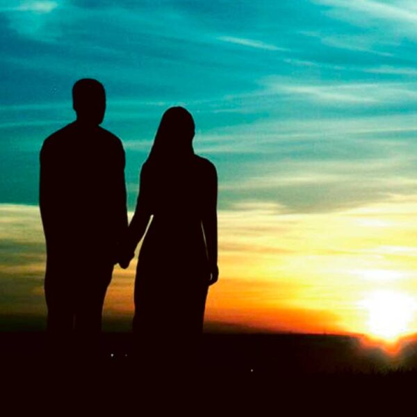 Silhouette of a couple holding hands as the sun sets, captured beautifully in an LED Box Frame, perfect for creating a romantic and serene atmosphere in your home.