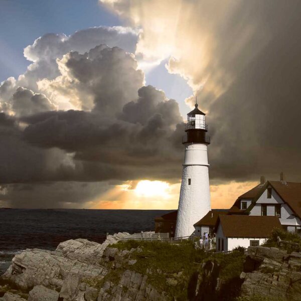 A lighthouse stands strong on rocky cliffs as storm clouds part and sunlight streams through over the ocean