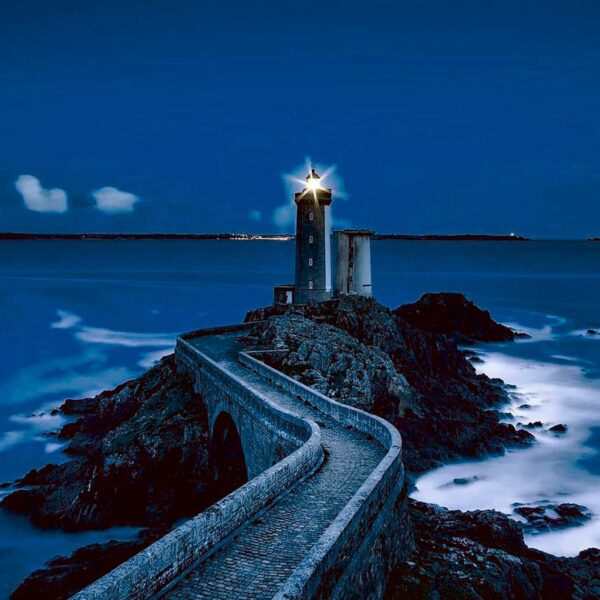 Coastal lighthouse with light beam, illuminated in an energy-efficient LED Box Frame, perfect for home and office decor.